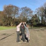 pupils outside with books