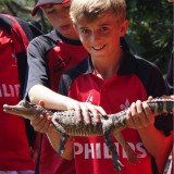 holding a aligator