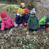 preschool nursery children snowdrops on walk