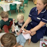 Nurse Chelcie visits the nursery children