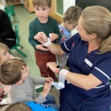 Nurse Chelcie visits the nursery children