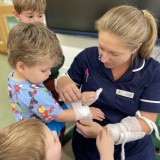 Nurse Chelcie visits the nursery children