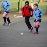 girls playing hockey