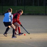 girls playing hockey