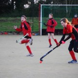 girls playing hockey