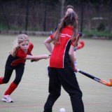 girls playing hockey