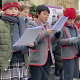 Chapel Choir singing at The Cross