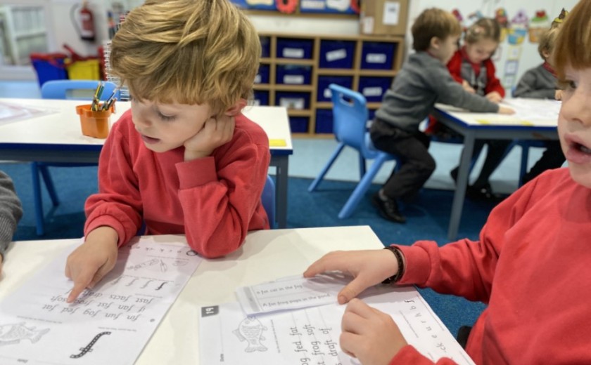 Children in Reception reading