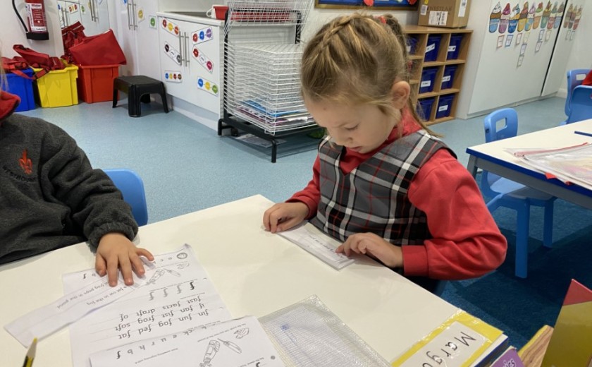 Children in Reception reading