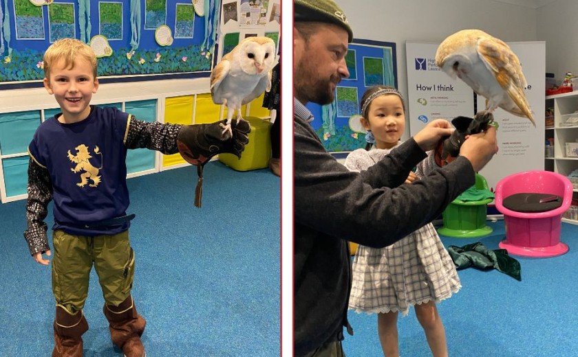 holding an owl