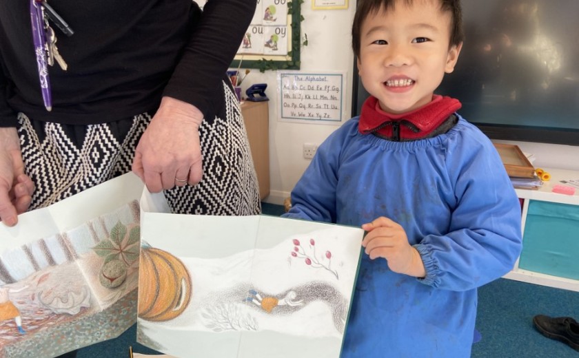 child shows book