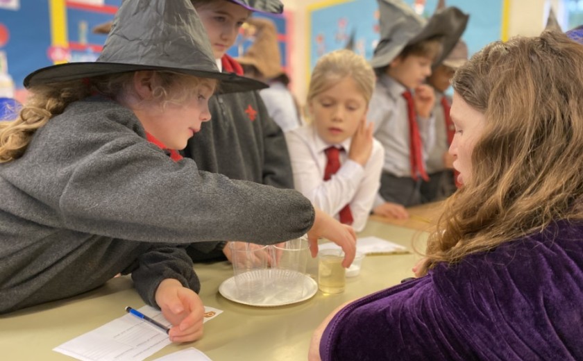 children doing science experiments in class