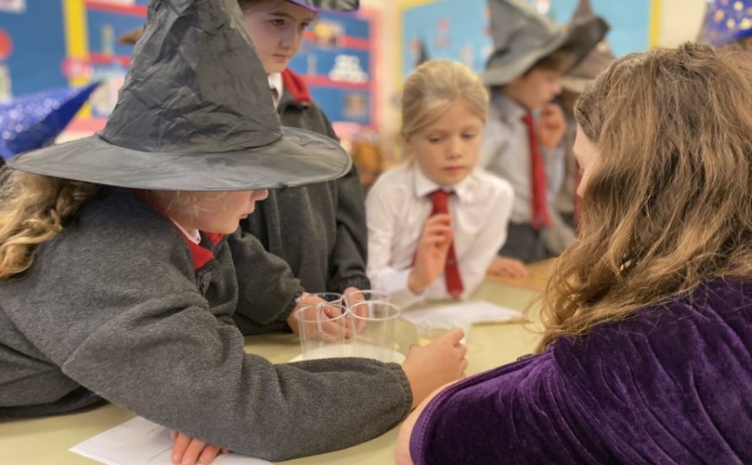 children doing science experiments in class