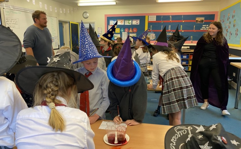 children doing science experiments in class