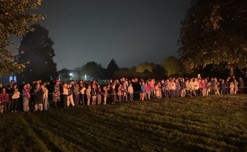 boarders' watch bonfire from a safe distance