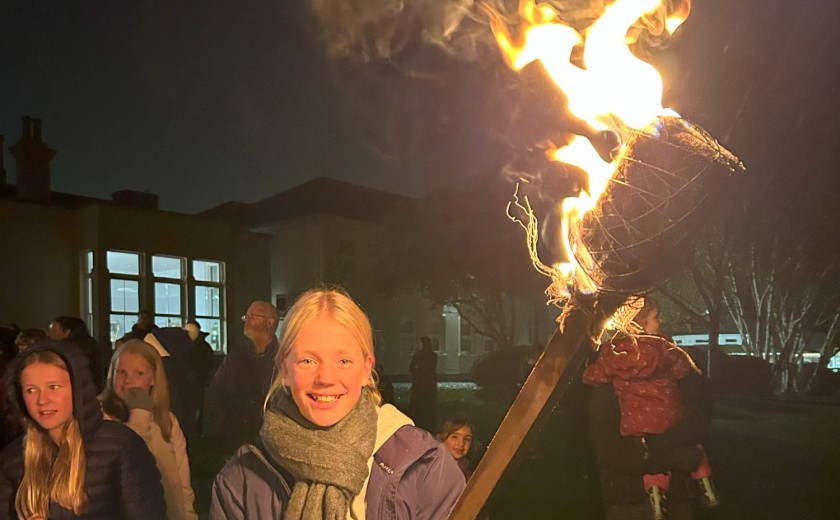 torch bearers light the bonfire