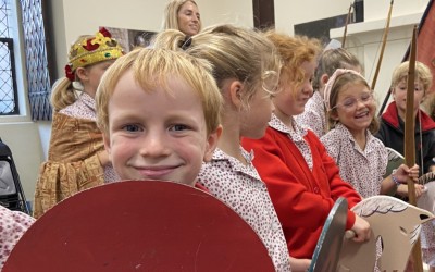 arundel castle visit by Year 2 boy holds shield